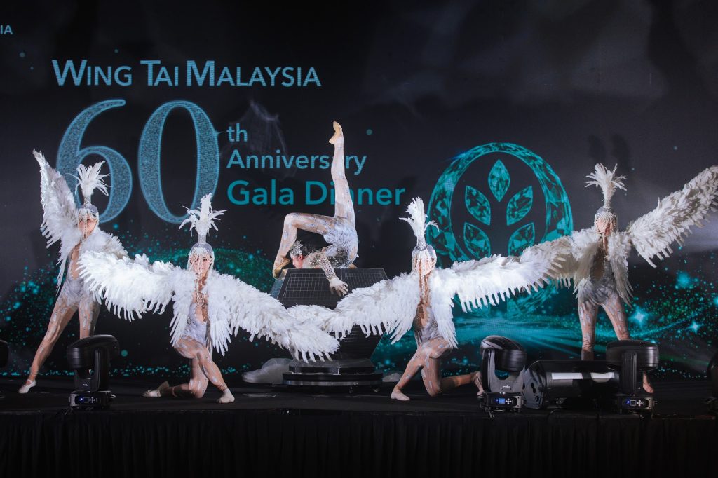 Dancers performing on stage at a company anniversary gala dinner